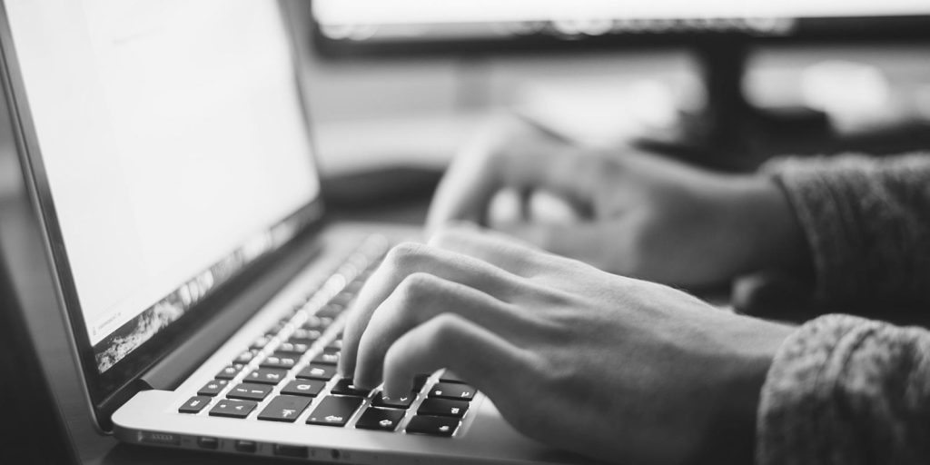 new patient registering through online portal on laptop